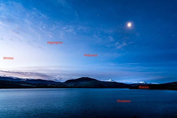 an image of a mountain and lake landscape with light labels