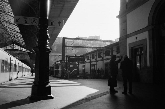 black and white photograph of a train platform