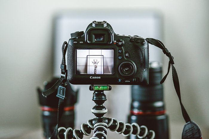 A DSLR camera on a tripod