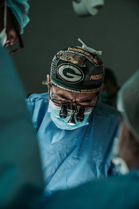 photograph of a surgeon in an operating room