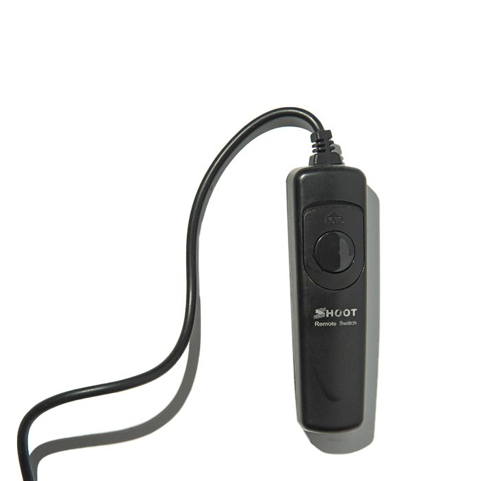 A close-up of a wired camera remote trigger