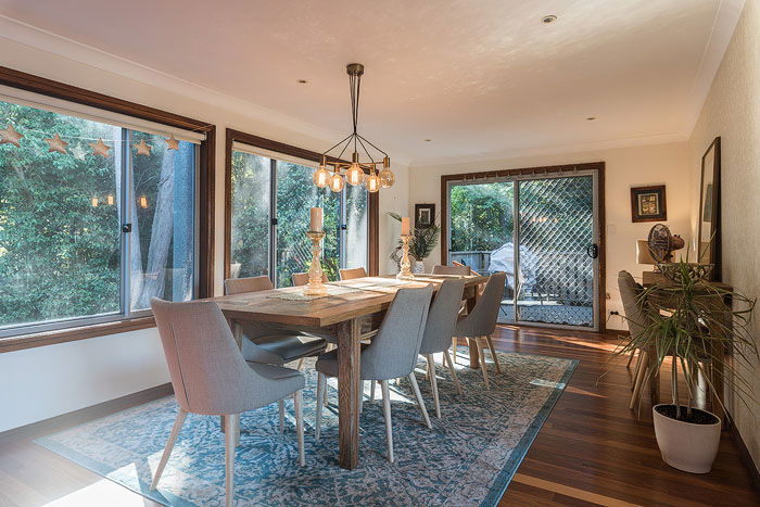 A dining room interior with big windows shot for real estate photography