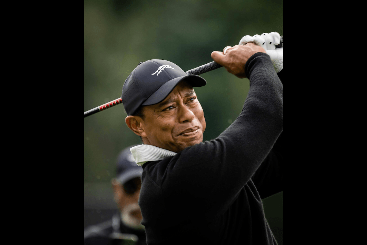Close-up of golfer Tiger Woods taking a swing taken by one of the best sports photographers Patrick Koenig