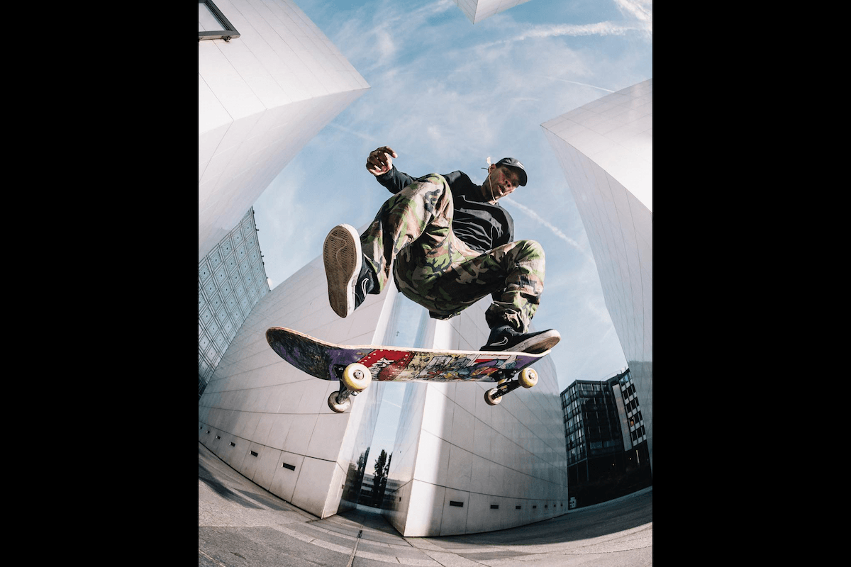 A fish-eye shot of a skateboarder doing a trick taken by one of the best sports photographers Teddy Morellec
