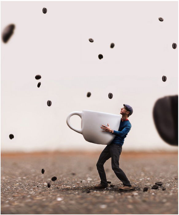 miniature scene of a man catching coffee beans with a cup as a creative Photoshop idea