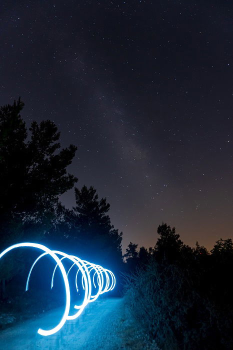 light painting blue hoops at night