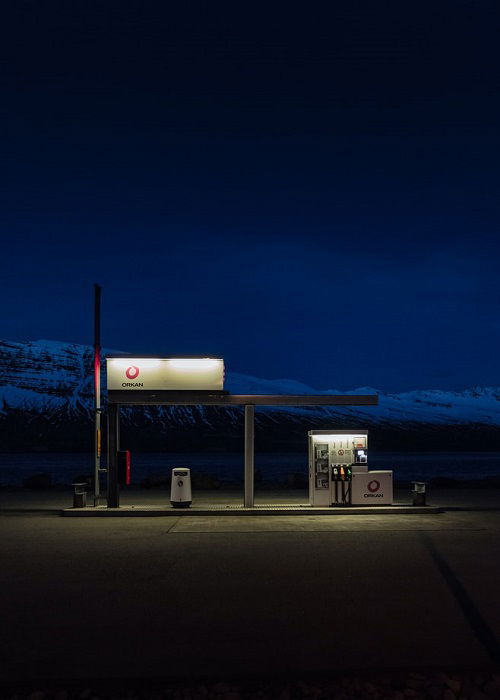 image of a petrol pump shot in low light with a dark landscape in the background