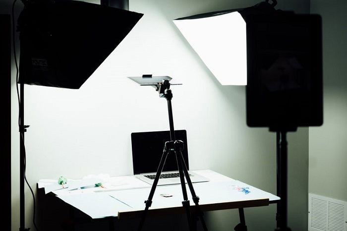 a behind the scenes shot of a miniature photography desk setup