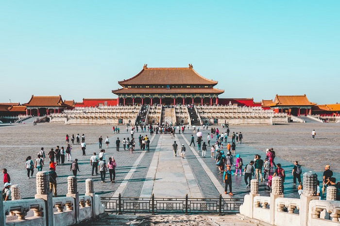 image of the Forbidden City with pedestrians in the foreground