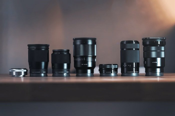 camera lenses lined up on a table