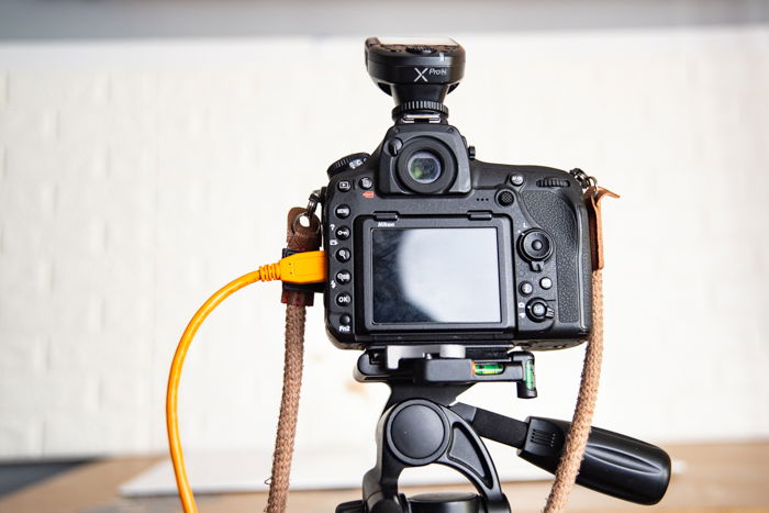 A closeup of a tethered camera