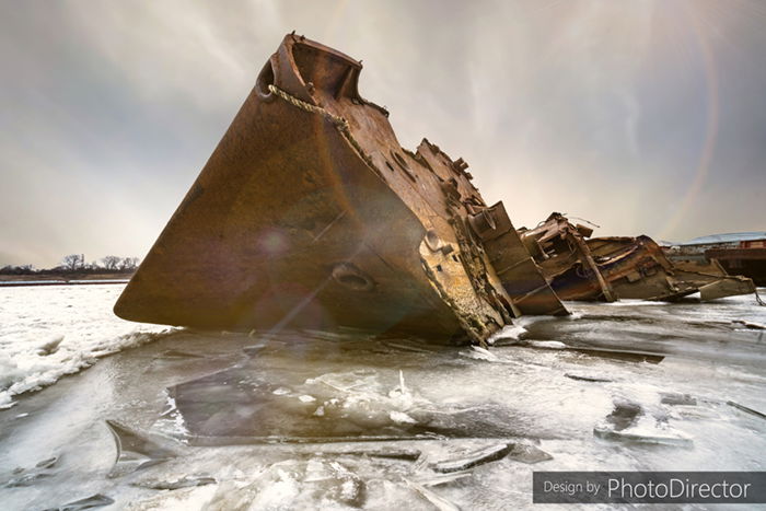 Rusted shipwreck on icy water with AI sky replacement using PhotoDirector 365