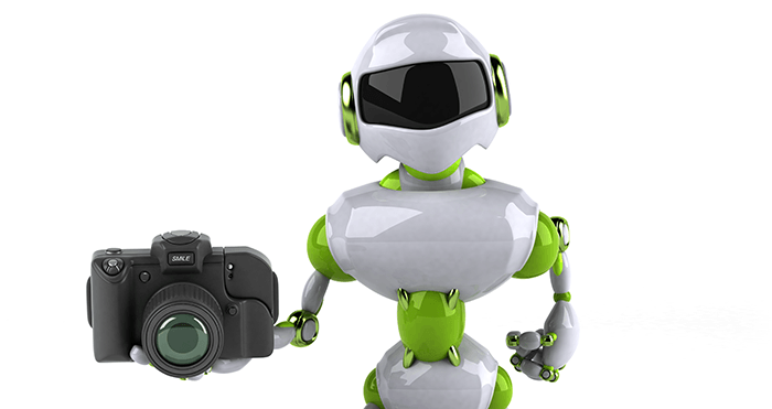 best ai camera apps: an image of a small robot holding a DSLR against a white background
