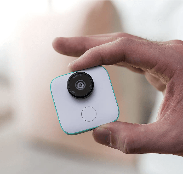 AI Photography: Close up shot of a person holding a Google Clips camera