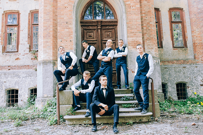 groomsmen photoshoot: a group of groomsmen posing on steps