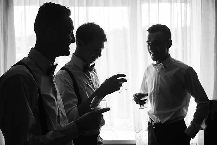 groomsmen photo inspiration: three groomsmen by window light