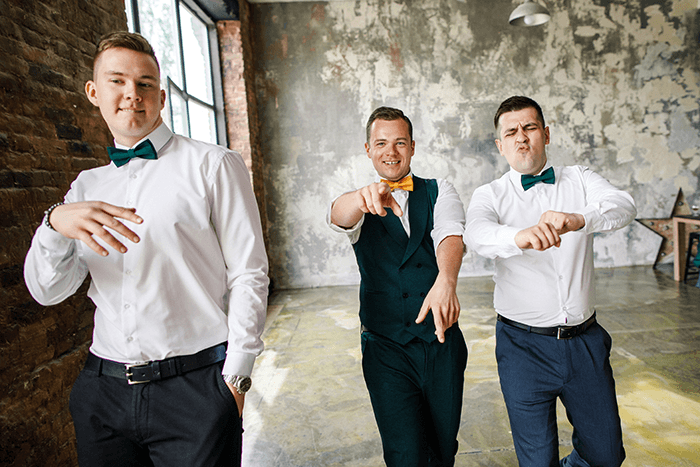 groomsmen picture idea: three groomsmen attempting to dance