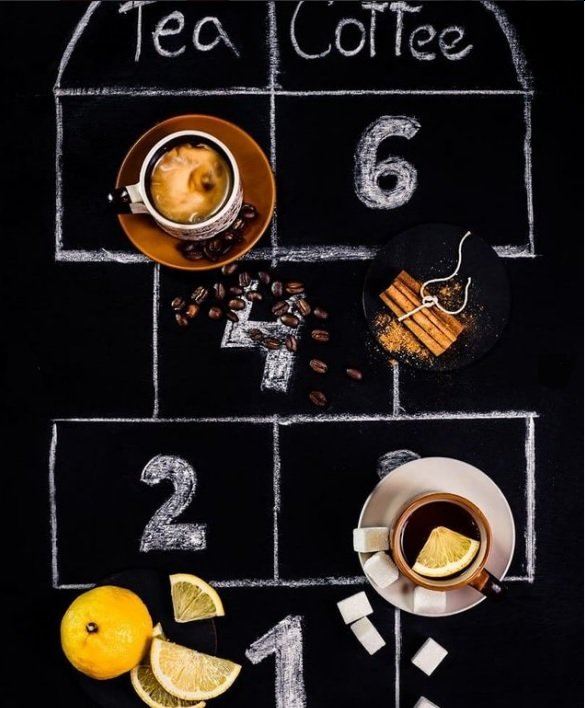 flat lay background idea: coffee and tea in mugs against a chalk board backdrop