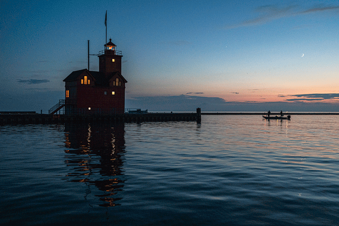 GIF made in Photoshop of a lighthouse boat and water reflections