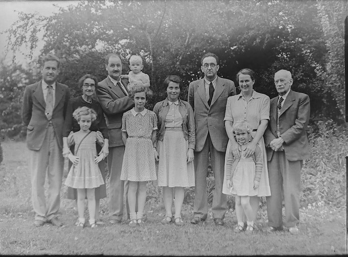 a black and white family portrait from many decades ago