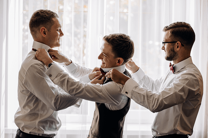 groomsmen photo tip: a photo of three groomsmen getting ready