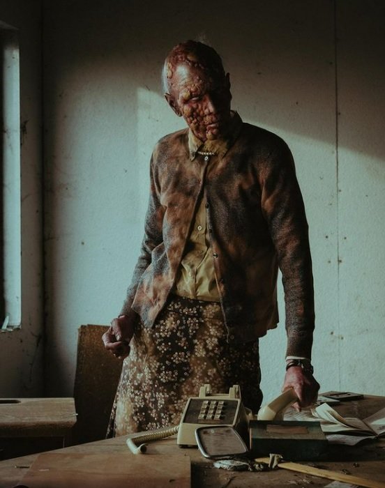 horror photography of a bloody zombie in a post apocalyptic building