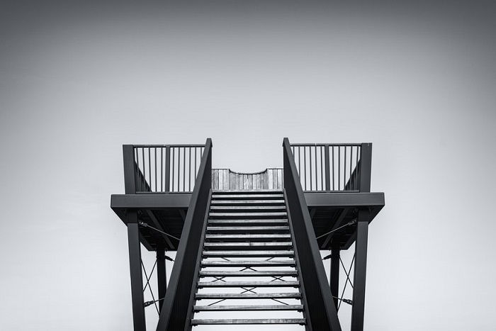 photo of symmetrical staircase in black and white