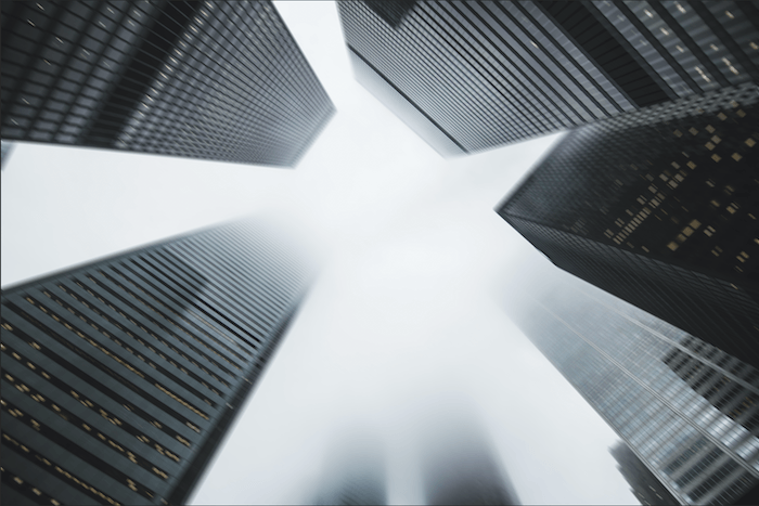 A Motion blur effect in Photoshop applied to an image of buildings rising into the sky