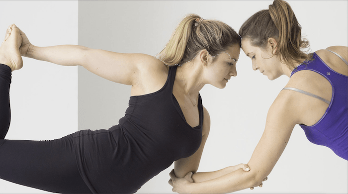 Close-up detail of Quick Selection tool action in image of two women in a yoga pose for composite photography