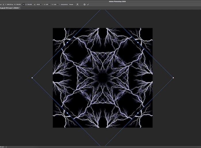 Screenshot of lightening image being rotated for kaleidoscope effect in Photoshop