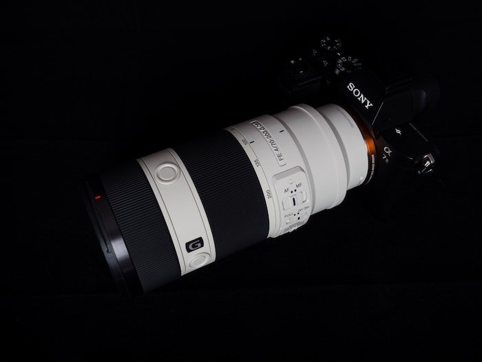 Sony g-series telephoto lens with Lens Abbreviations attached to a sony camera