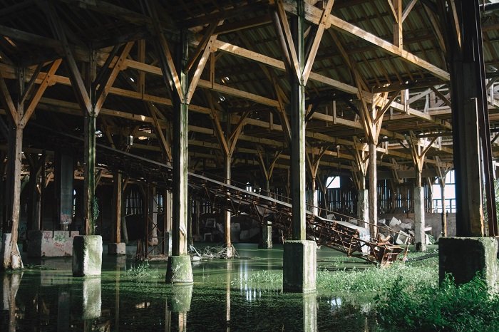 a photo inside an abandoned industrial building