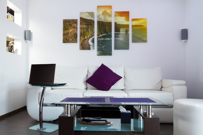 Canvas photo prints hung up on living room wall