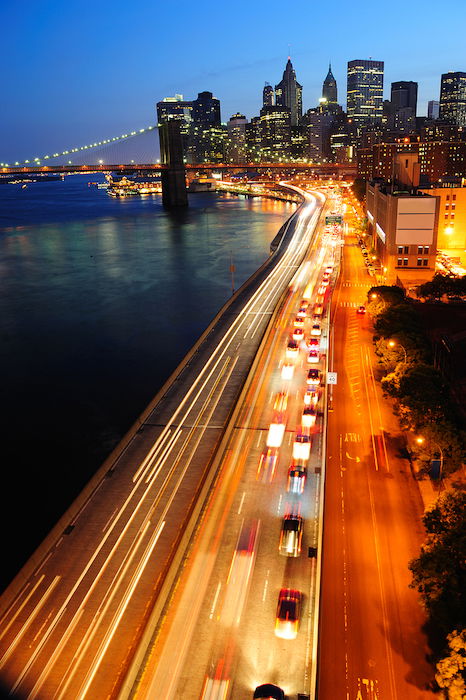 night cityscape photography: New York City cityscape at dusk with traffic light trails