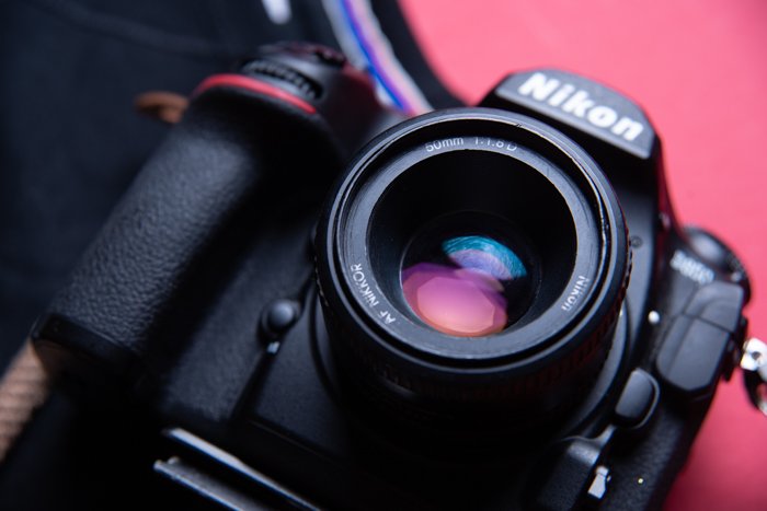 A closeup shot of a 50mm lens on a camera