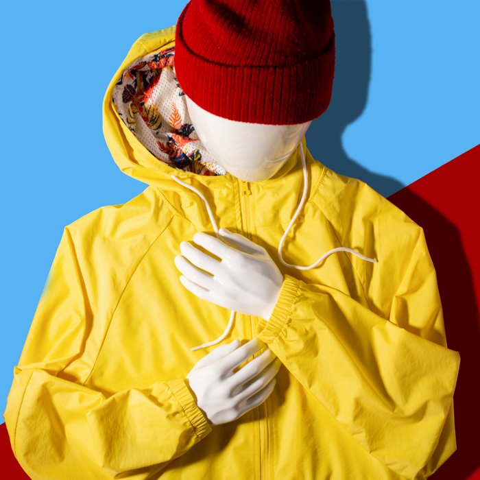 Flat Lay Photography for Clothing: A flat lay image of a raincoat and cap on a mannequin