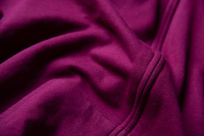 Close up detail of pink clothing with ridges and shadows for flat lay photography