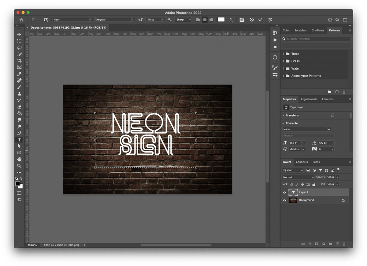 Using the text tool to type neon sign on our text layer