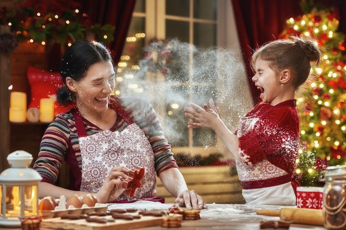 Mother and child baking cookies as a Christmas card photo idea