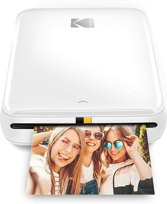 gifts for photographers: product photo of the Kodak Wireless Mini Photo Printer printing a selfie of three women in glasses