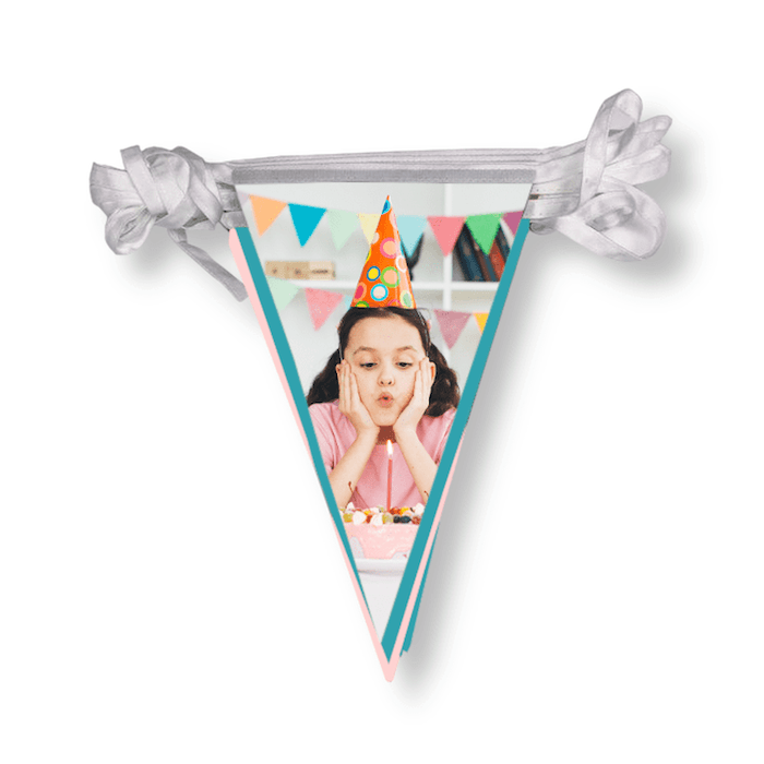 Image of a girl blowing out a birthday candle on bunting for photo gift ideas