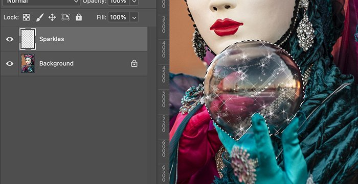 Screenshot of layers and an orb selected with a sparkle effect in Photoshop