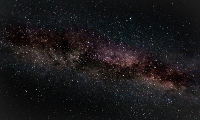 an image of a galaxy in the night sky with an astrophotography filter