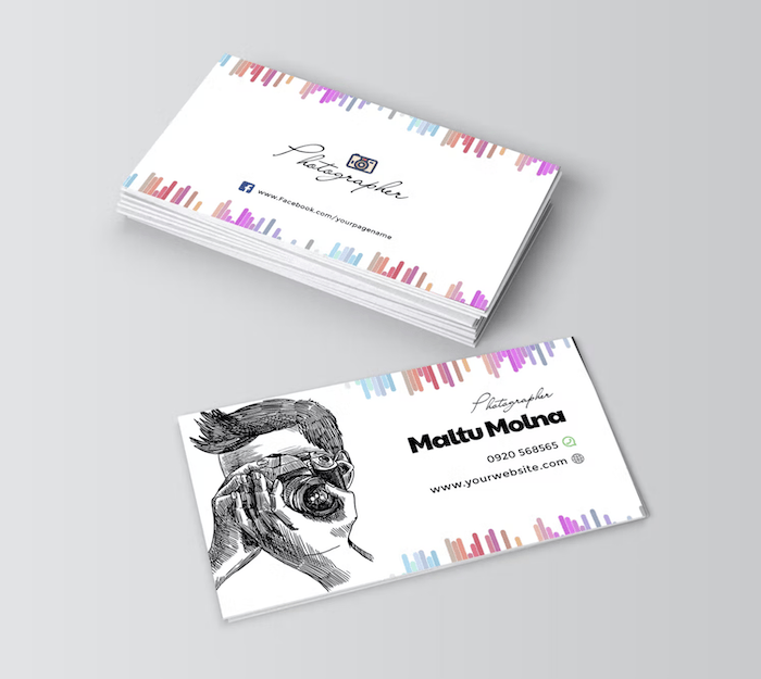 photographer business cards with a drawing of a photographer 