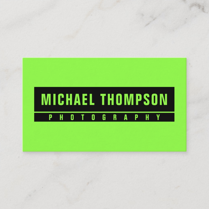 a vibrant neon green fluorescent photography business card design