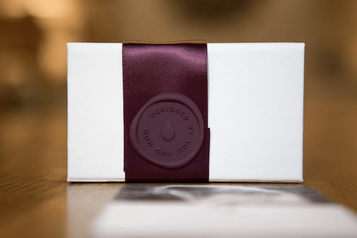 wax seal stamp on ribbon on a photography business card 