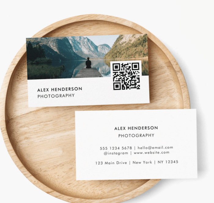 Photography business cards on a wooden plate