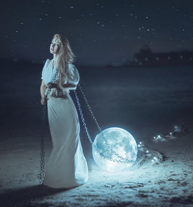 Surreal Photography example of a woman in dress dragging the Moon