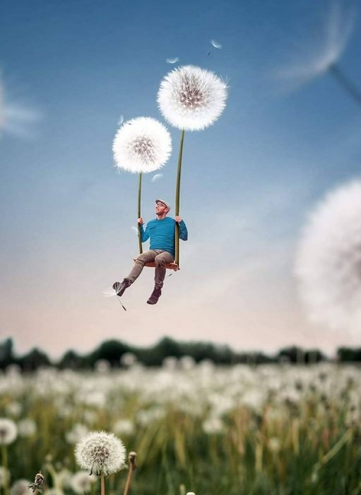 an image of Joel Robinson swinging on dandelions as an example of surreal photography