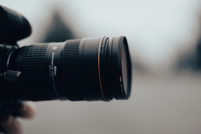 to filter or not to filter: Close-up side view of a long camera lens